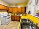 Bright, spacious kitchen with yellow countertops and cabinets, a vintage design at 1019 10Th W Ave, Bradenton, FL 34205