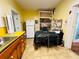 Cozy kitchen featuring yellow walls, a white refrigerator, and an adjacent workspace at 1019 10Th W Ave, Bradenton, FL 34205