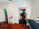 Cozy living room with hardwood floors and view into a blue painted room at 1019 10Th W Ave, Bradenton, FL 34205