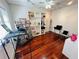 Bright and spacious room featuring hardwood floors, display shelving, and flexible open space at 1019 10Th W Ave, Bradenton, FL 34205