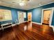 Large blue room with hardwood floors, bright windows, and plenty of light at 1019 10Th W Ave, Bradenton, FL 34205