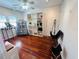 Sunlit room with hardwood floors, display shelving, and flexible open space at 1019 10Th W Ave, Bradenton, FL 34205