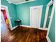 A green painted room with hardwood floors and doorway at 1019 10Th W Ave, Bradenton, FL 34205
