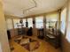 Cozy sunroom bathed in natural light with geometric flooring and display shelving at 1019 10Th W Ave, Bradenton, FL 34205
