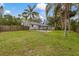 The fenced-in backyard features a gazebo on a concrete patio at 102 28Th W St, Bradenton, FL 34205
