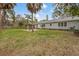 The backyard boasts a gazebo and a wood privacy fence at 102 28Th W St, Bradenton, FL 34205