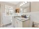 Bathroom with granite countertop vanity and ample natural lighting at 102 28Th W St, Bradenton, FL 34205