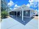 Charming single-story home with a covered porch and well-maintained landscaping at 10315 Cortez W Rd # 32-7, Bradenton, FL 34210