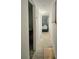 Hallway leads to bedroom, showcasing the layout and flow of the home at 10315 Cortez W Rd # 32-7, Bradenton, FL 34210