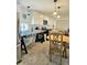 Bright kitchen with white cabinets, modern appliances, and a cozy dining area at 10315 Cortez W Rd # 32-7, Bradenton, FL 34210