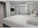 Bright main bedroom features a comfortable bed, modern dresser, and ample closet space at 10315 Cortez W Rd # 32-7, Bradenton, FL 34210