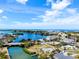 Aerial view of a coastal neighborhood with waterfront homes and stunning ocean views at 104 Pops Ln, Nokomis, FL 34275