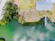 An aerial view of the lot and dock shows the waterfront access at 104 Pops Ln, Nokomis, FL 34275
