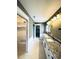 Bathroom features a double vanity with granite countertops and modern lighting fixtures at 104 Pops Ln, Nokomis, FL 34275