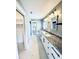 Bathroom boasting granite counters, dual sinks and white shaker cabinets at 104 Pops Ln, Nokomis, FL 34275