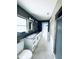 Updated bathroom with a double vanity, granite countertop, and modern fixtures, providing a luxurious feel at 104 Pops Ln, Nokomis, FL 34275