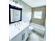 Bathroom featuring tub, neutral tile and ample natural light at 104 Pops Ln, Nokomis, FL 34275