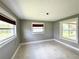 Bedroom featuring natural light from multiple windows with woven shades at 104 Pops Ln, Nokomis, FL 34275