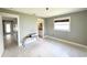 A bright bedroom featuring ample natural light and neutral color scheme at 104 Pops Ln, Nokomis, FL 34275