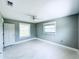 Bedroom featuring new carpet, gray walls and a ceiling fan at 104 Pops Ln, Nokomis, FL 34275