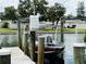 Private boat lift with boat provides convenient waterfront access at 104 Pops Ln, Nokomis, FL 34275