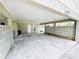 Spacious carport area with decorative concrete block accents and ample parking at 104 Pops Ln, Nokomis, FL 34275