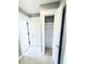 Hallway view of a bedroom and closet doors plus neutral paint and neutral carpet at 104 Pops Ln, Nokomis, FL 34275