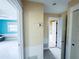 Hallway view showcases the home's open layout and neutral tones at 104 Pops Ln, Nokomis, FL 34275