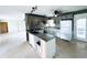 Spacious kitchen with island and granite countertops, perfect for cooking and entertaining at 104 Pops Ln, Nokomis, FL 34275