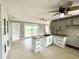 Bright kitchen features granite countertops, ample cabinetry, and backyard access at 104 Pops Ln, Nokomis, FL 34275
