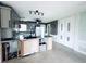 Bright kitchen island featuring granite countertop and cabinets plus additional pantry storage at 104 Pops Ln, Nokomis, FL 34275