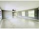 Spacious living room with ample natural light from multiple windows at 104 Pops Ln, Nokomis, FL 34275