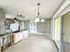 Spacious living room with sliding glass doors leading to outdoor living space at 104 Pops Ln, Nokomis, FL 34275