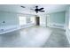 Bright and airy living room with ceiling fan, natural light and ample space for entertaining at 104 Pops Ln, Nokomis, FL 34275