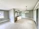 Spacious living room with sliding glass doors leading to outdoor living space at 104 Pops Ln, Nokomis, FL 34275