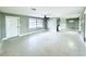 Bright open-concept living room featuring neutral tones and a ceiling fan at 104 Pops Ln, Nokomis, FL 34275