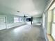 Open-concept living room with expansive windows and ample natural light, ready for renovation at 104 Pops Ln, Nokomis, FL 34275