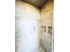 Beautifully tiled shower with multiple recessed shelves for storage at 104 Pops Ln, Nokomis, FL 34275