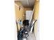Functional storage room features ample space for tools and project supplies, and access to an exterior door at 104 Pops Ln, Nokomis, FL 34275