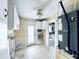 Functional utility room equipped with storage cabinets, water heater, and laundry hookups, offering convenience and organization at 104 Pops Ln, Nokomis, FL 34275