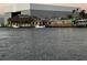 Waterfront restaurant by the water with boats nearby at 104 Pops Ln, Nokomis, FL 34275