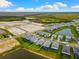 New construction homes featuring screened-in patios and beautiful green lawns in a well-planned community setting at 10868 Sun Drop St, Venice, FL 34293