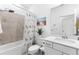 Bright bathroom featuring neutral colors, shower-tub combo, and modern vanity at 10868 Sun Drop St, Venice, FL 34293