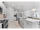 Spacious kitchen featuring a large island, stainless steel appliances, and an open layout at 10868 Sun Drop St, Venice, FL 34293