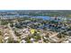 Aerial view of home in a residential neighborhood, close to water and green spaces at 112 E Marland Ct, Nokomis, FL 34275