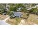 An aerial view of the home with a fenced backyard and a driveway leading to the home at 112 E Marland Ct, Nokomis, FL 34275