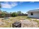 The home features a spacious fenced backyard with some landscaping at 112 E Marland Ct, Nokomis, FL 34275