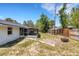This property features a fenced backyard with mature trees and a patio at 112 E Marland Ct, Nokomis, FL 34275