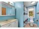 Charming bathroom featuring a toilet, sink, and shower/tub combo with a colorful shower curtain at 112 E Marland Ct, Nokomis, FL 34275