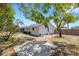 This property features a large backyard, patio, fence, and some trees at 112 E Marland Ct, Nokomis, FL 34275